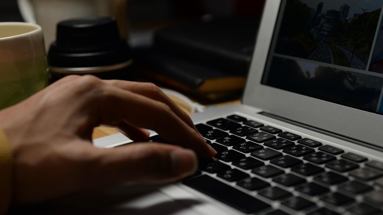 person using laptop studying ai tutorial
