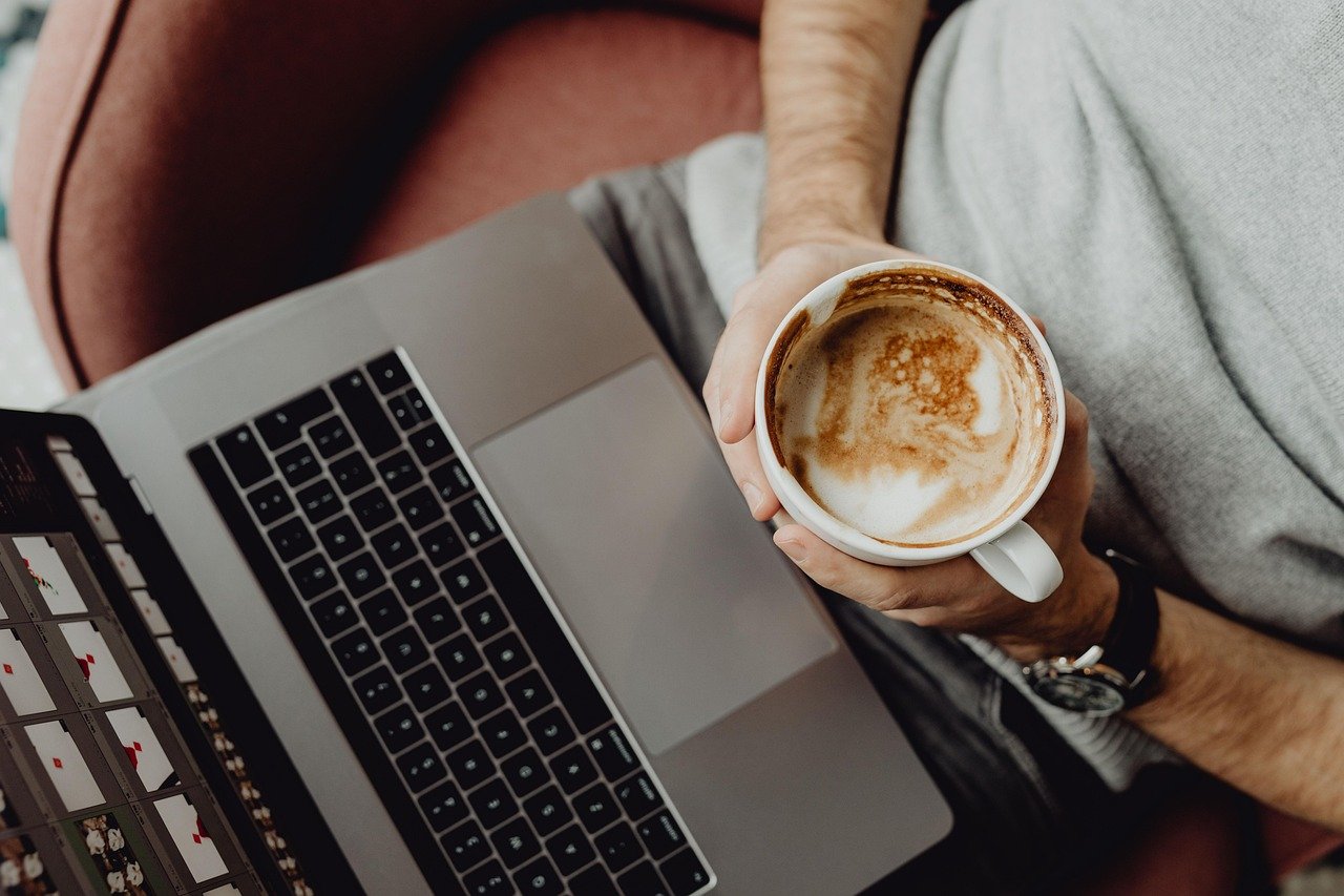 person using laptop AI writing